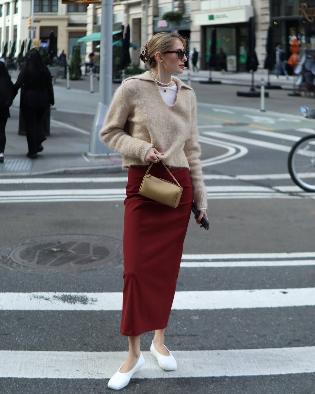 Woman in ballet flats with a feminine midi skirt